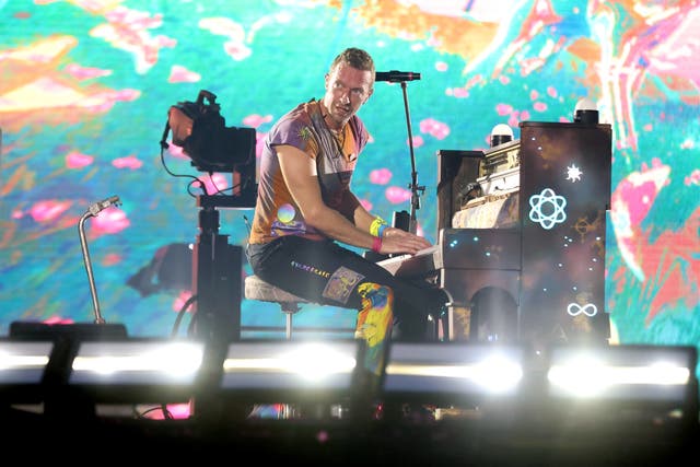 Coldplay’s Chris Martin performing on stage at Wembley Stadium (Suzan Moore/PA)