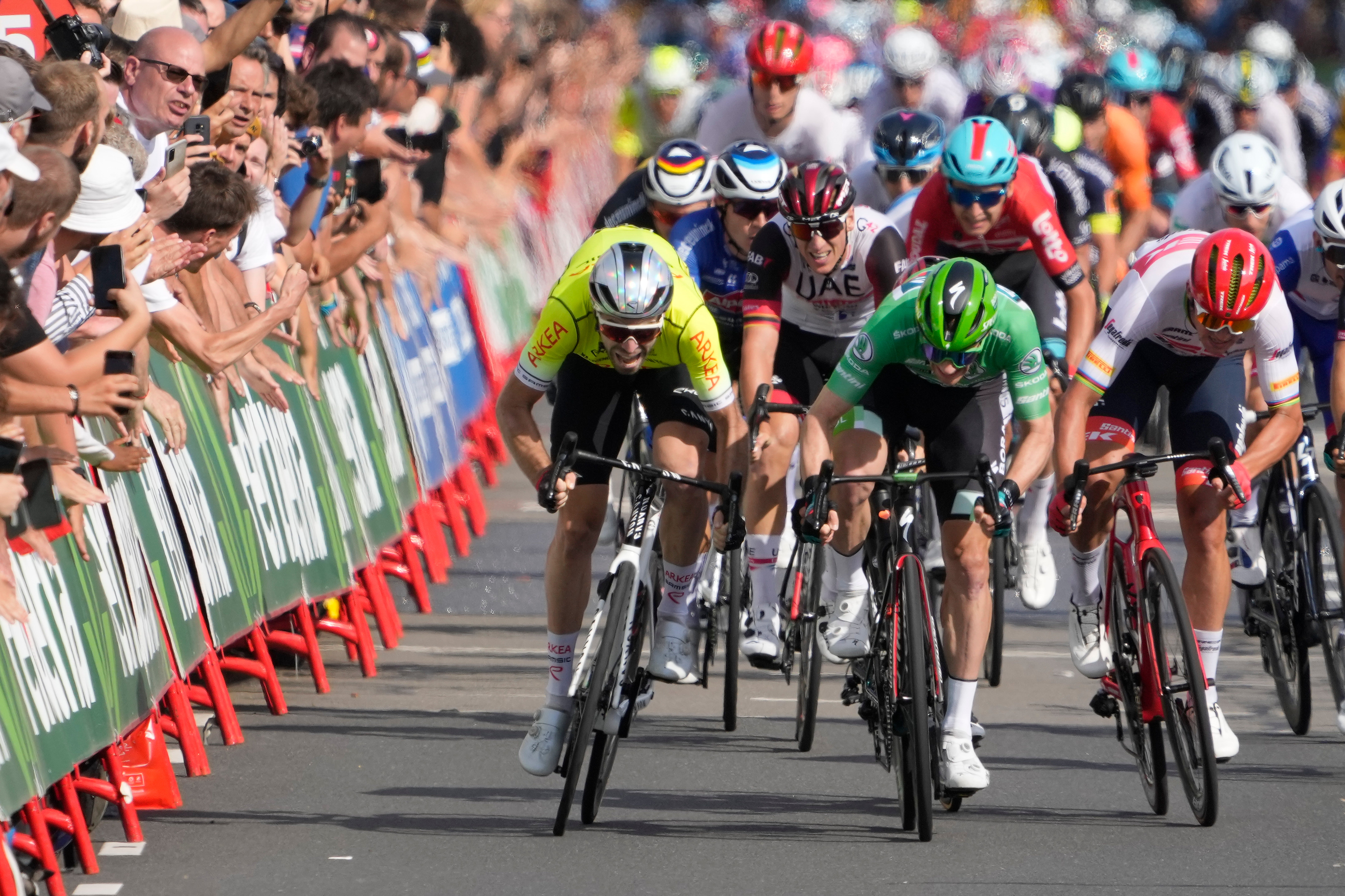 Ireland’s Sam Bennett, wearing the best sprinter’s green jersey, wins stage three in the Vuelta a Espana (Peter Dejong/AP)