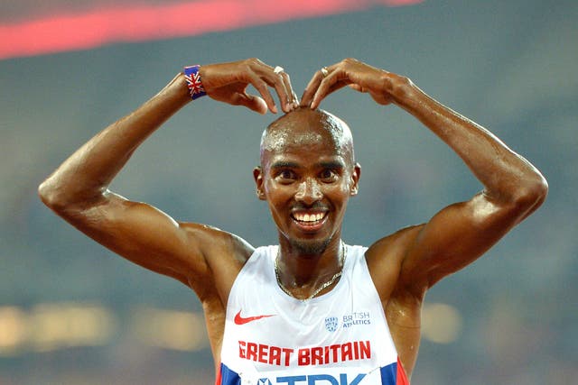 Mo Farah celebrates after winning gold in the 10,000 metres during the 2015 World Championships in Beijing (Adam Davy/PA)