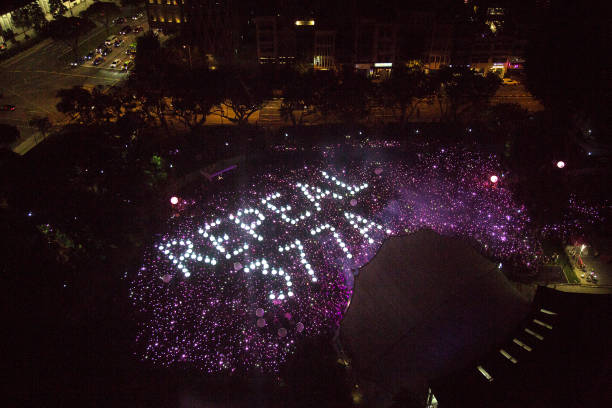 Attendees form the characters Repeal 377A in a call to repeal Section 377A of Singapore's Penal Code which criminalises sex between men during the Pink Dot event in 2019