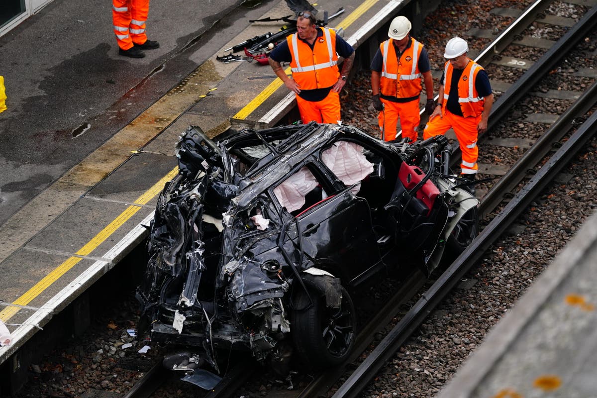 Woman dies in crash that leaves Range Rover on railway track