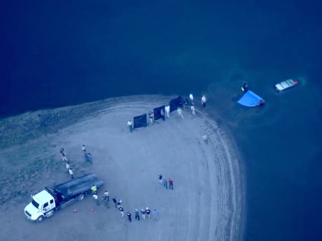 <p>Helicopters for KCRA-TV pictured the vehicle being retrieved from the Prosser Creek Reservoir </p>