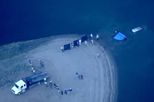 <p>Helicopters for KCRA-TV pictured the vehicle being retrieved from the Prosser Creek Reservoir </p>
