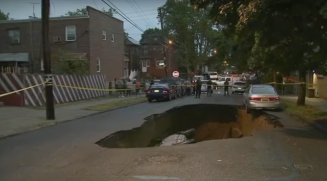 <p>A sinkhole on Radcliff Avenue in the Bronx borough of New York City last month</p>