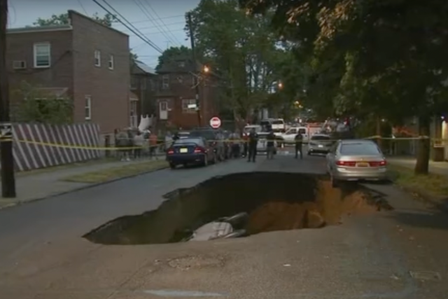 <p>A sinkhole on Radcliff Avenue in the Bronx borough of New York City last month</p>