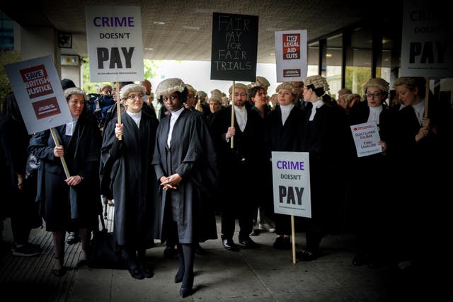 <p>Barristers on the picket line outside Manchester Crown Court in June</p>