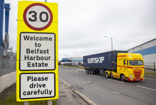 Haulage lorry drives passed a sign at Belfast Port welcoming travellers to the Harbour Estate (Liam McBurney/PA)