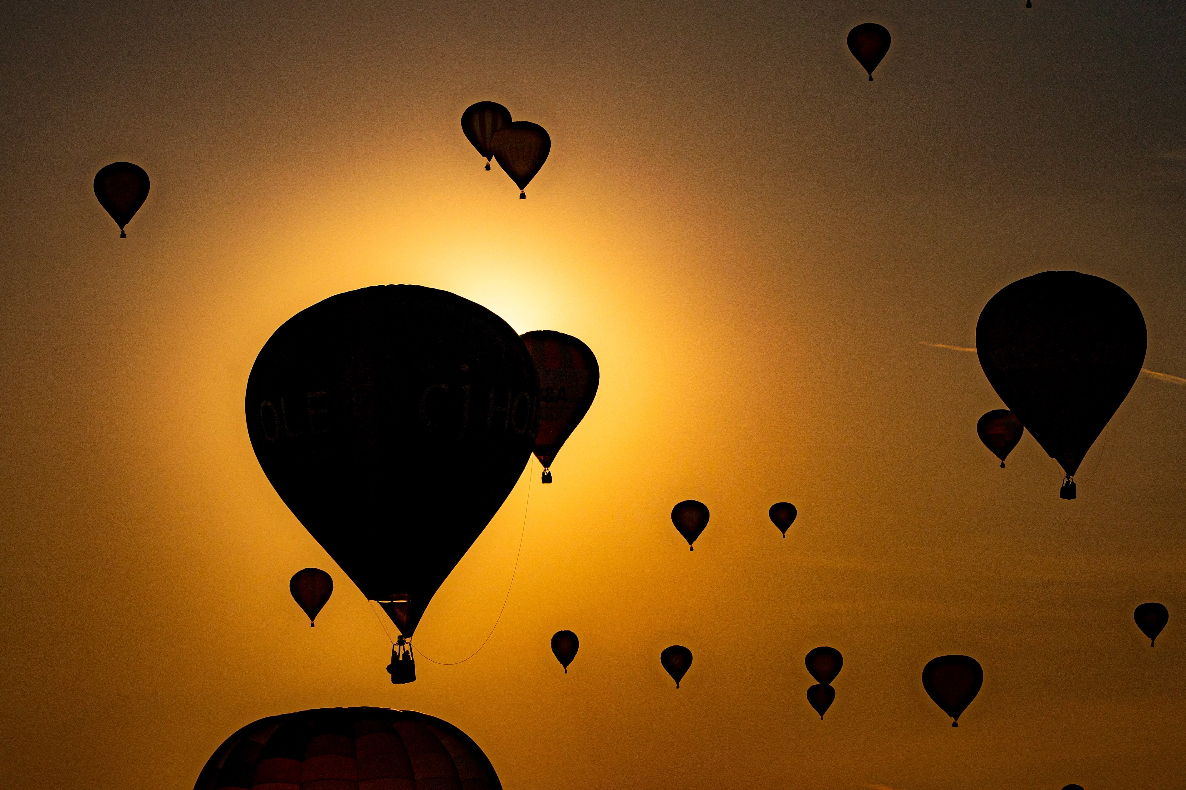 Hot air balloons pass by the rising sun as they fly over North Somerset last week