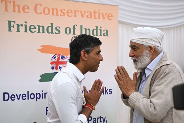 <p>Rishi Sunak meets members of the audience after addressing the Conservative Friends of India at Dhamecha Lohana Centre in South Harrow</p>