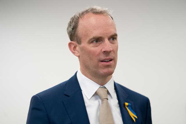 Justice Secretary Dominic Raab accused striking barristers of “holding justice to ransom” after it emerged he was on holiday when an all-out strike ballot was taken (Joe Giddens/PA)
