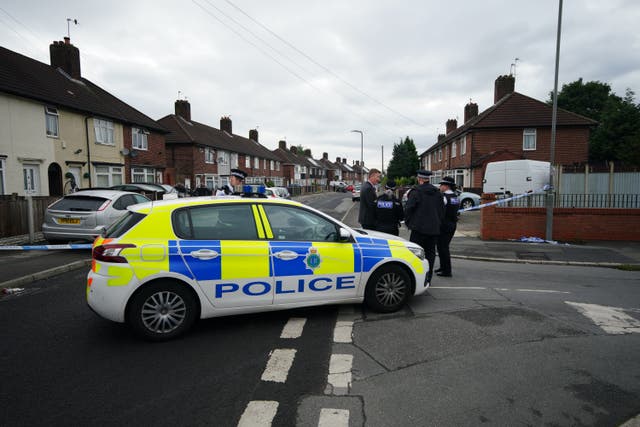 A police cordon at the scene in Knotty Ash where a nine-year-old girl has been fatally shot (Peter Byrne/PA)