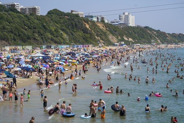 <p>The beach in Bournemouth on July 19 2022, the hottest day ever recorded in the UK (Steve Parsons/PA)</p>