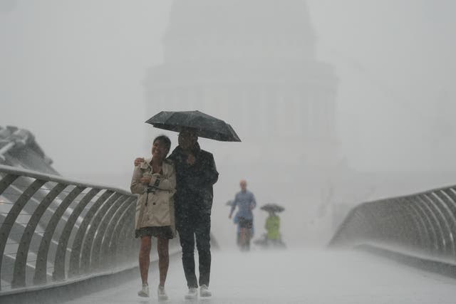 <p>After weeks of sweltering weather, heavy rain hit parts of England – but it is not enough to end the drought (Victoria Jones/PA)</p>