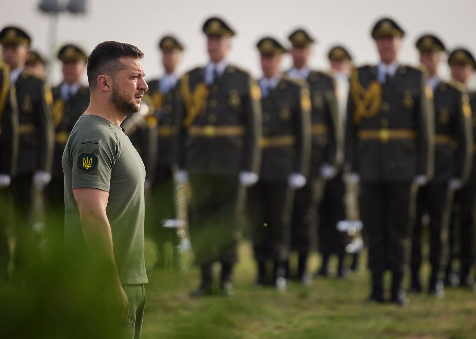 Zelensky stands in front of troops at State Flag Day celebrations in the capital on Tuesday