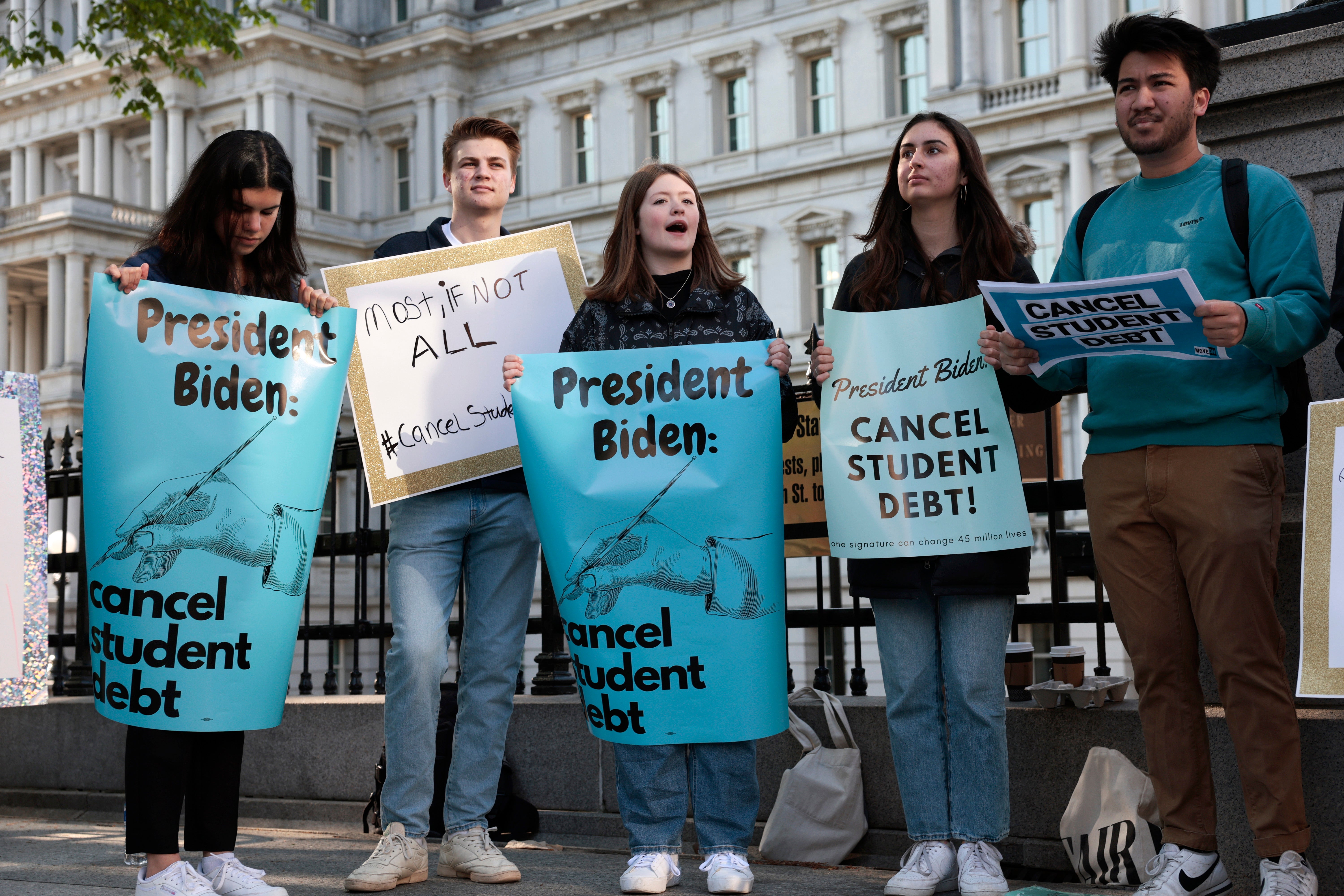 Student loan debt relief advocates rally outside the White House in April 2022.