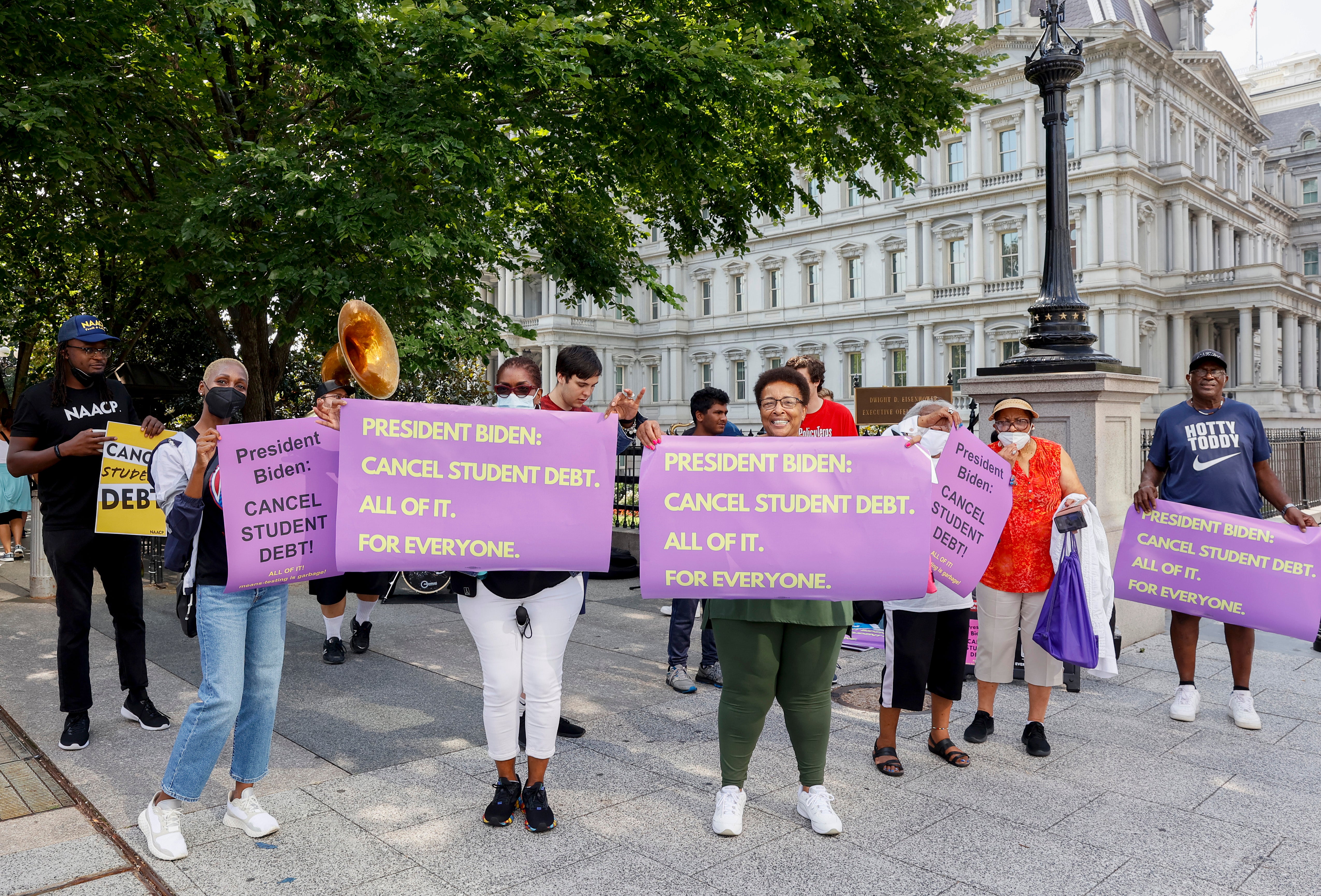 Student loan debt relief advocates hold a demonstration outside the White House in July 2022.