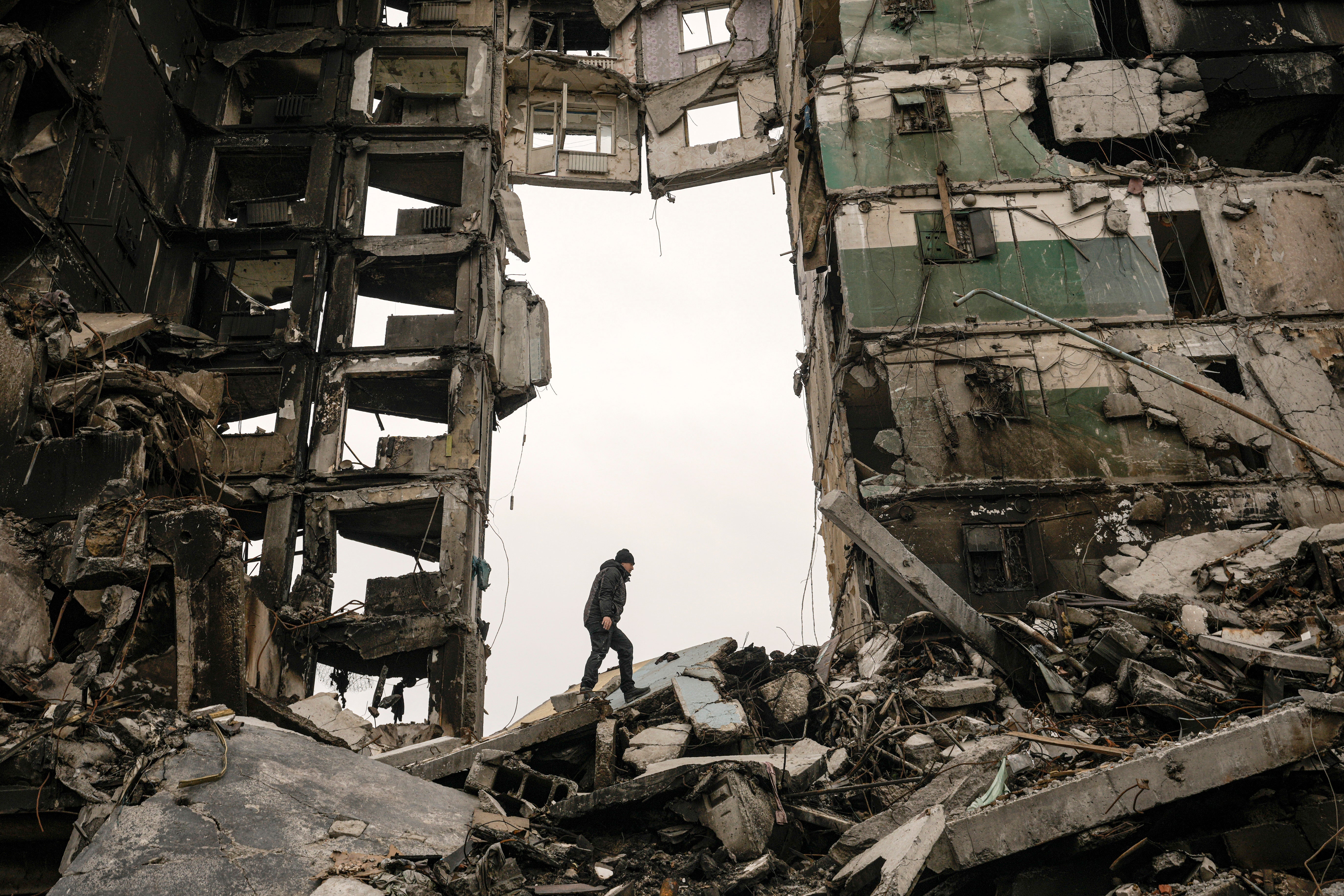 A resident walks amid rubble in Borodyanka, Ukraine, on 5 April, 2022.