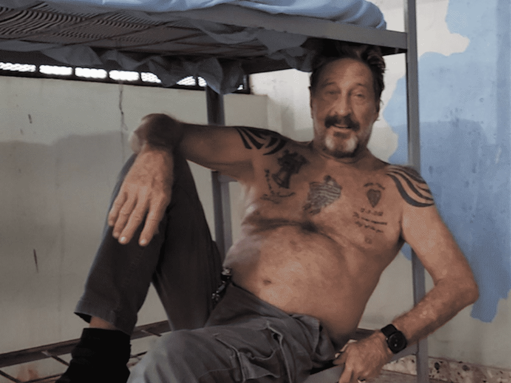 John McAfee, pictured here in a prison cell in the Caribbean, was found dead in a Spanish prison cell on 23 June, 2021