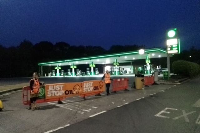 <p>Just Stop Oil activists blockade a petrol station on the M25 on Wednesday morning</p>
