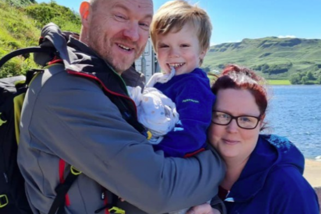 <p>Arran Cochrane with his parents on holiday in Scotland</p>