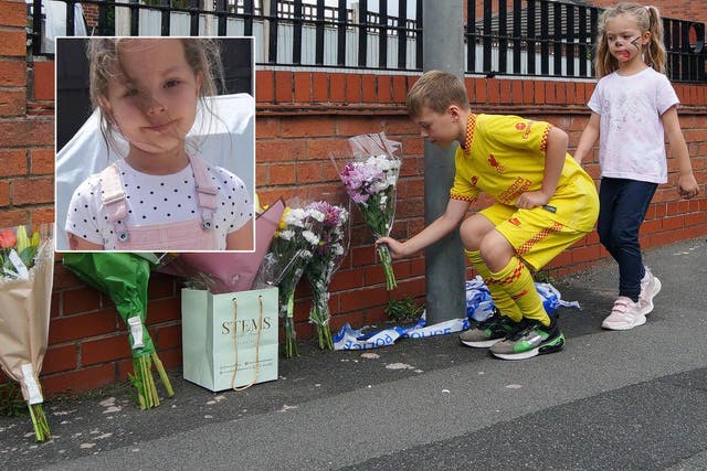 <p>Children leave flowers near to the scene in Kingsheath Avenue, Knotty Ash, Liverpool, where nine-year-old Olivia Pratt-Korbel was killed </p>