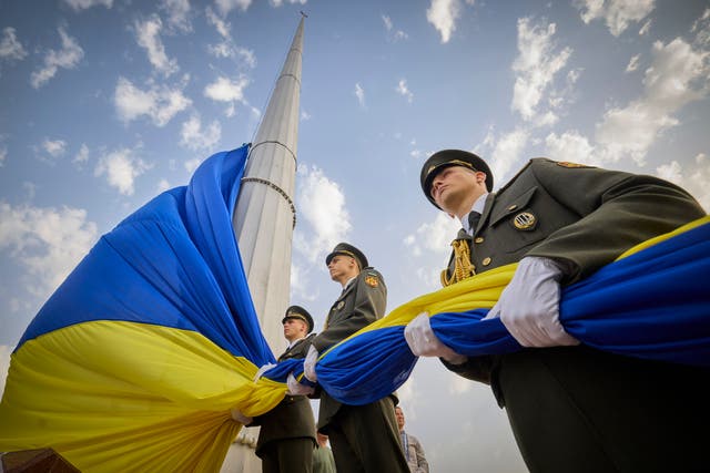 Honour guard soldiers prepare to rise the Ukrainian national flag (Ukrainian Presidential Press Office via AP)