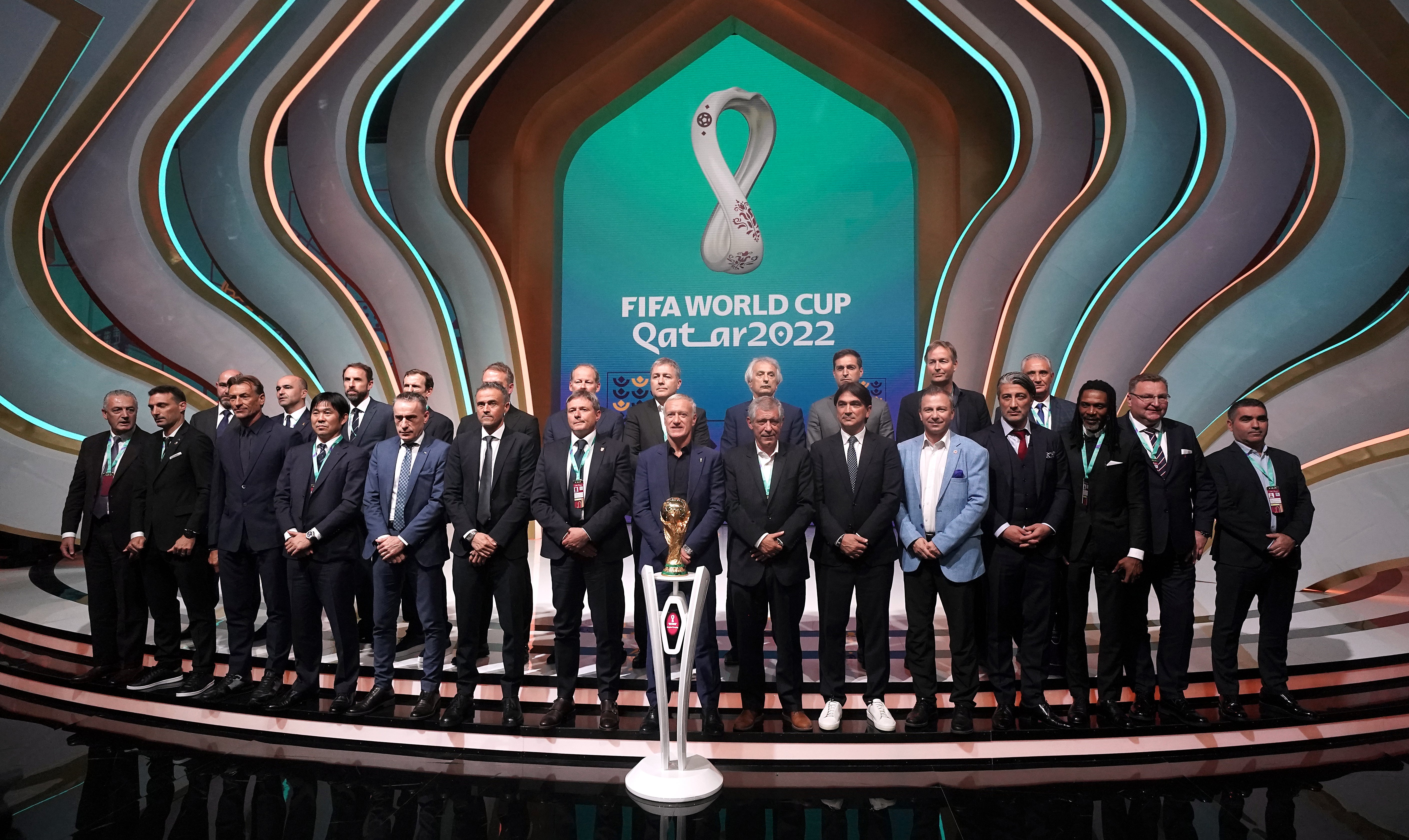 England manager Gareth Southgate (back row, third left) on stage during the World Cup Qatar 2022 draw at the Doha Exhibition and Convention Centre (Nick Potts/PA)