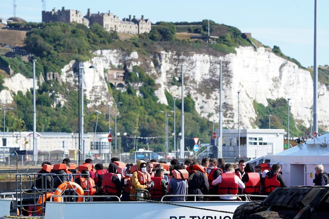 A group of people thought to be migrants are brought in to Dover, Kent, from a Border Force Vessel (Gareth Fuller/PA)