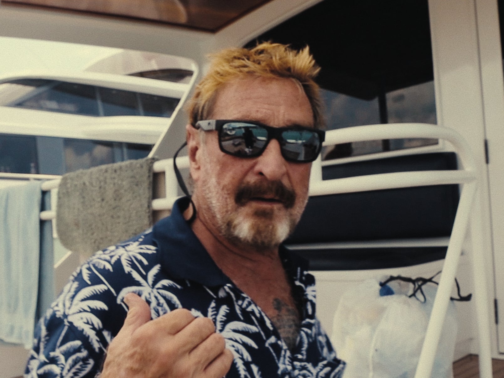 Running with the Devil: The Wild World of John McAfee. John McAfee in Running with the Devil: The Wild World of John McAfee. Cr. Courtesy of Netflix © 2022