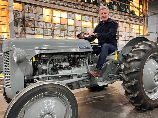 Patrick Kielty drives a Ferguson TO-20 through the former site of the Ferguson Park factory, Detroit 1 (BBC NI/PA)