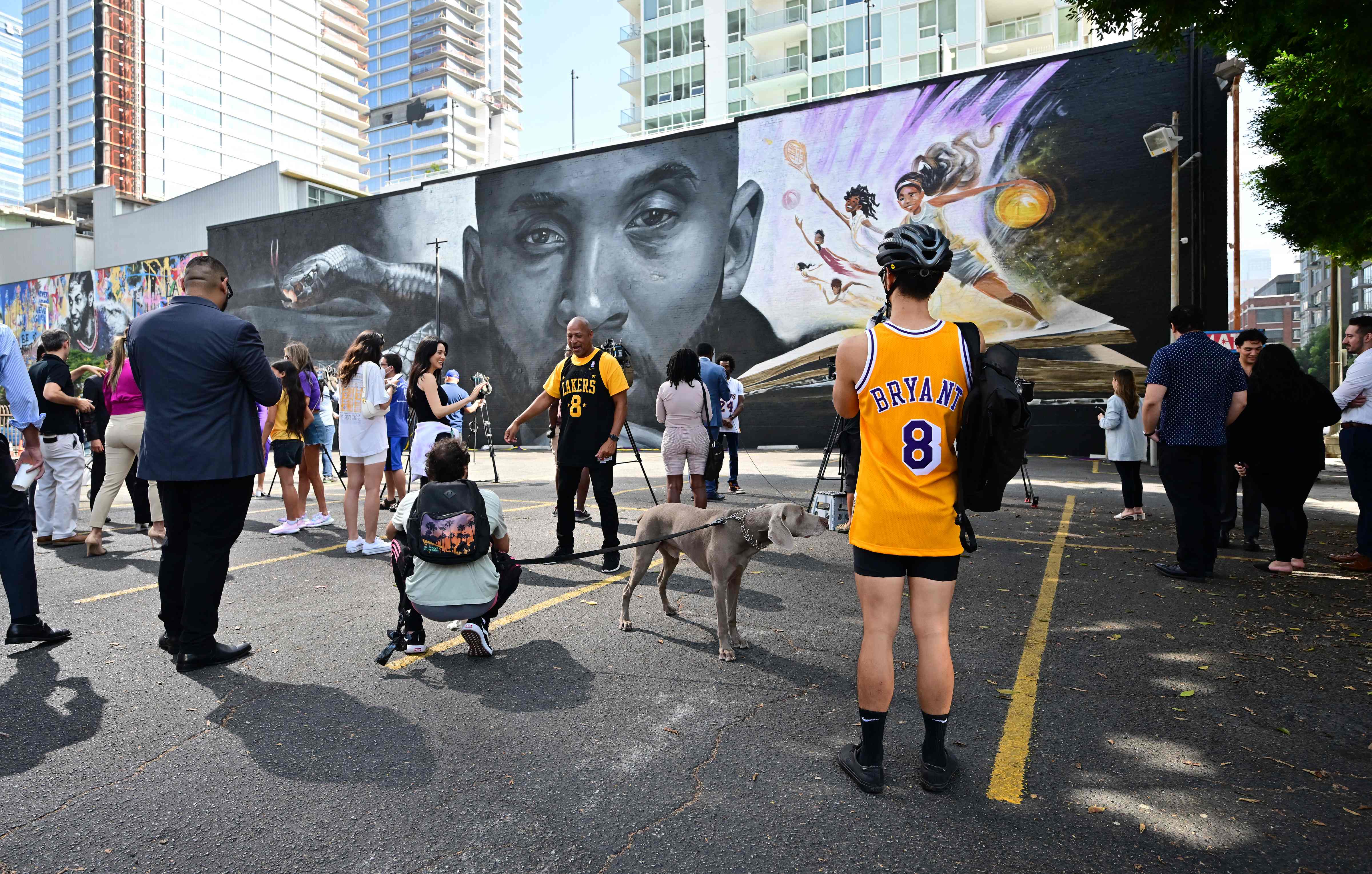 People attend the unveiling of a a new mural of Kobe Bryant, created by Odeith and Los Angeles-based illustrator Nikkolas Smith, outside the headquarters of West Coast Trial Lawyers in LA