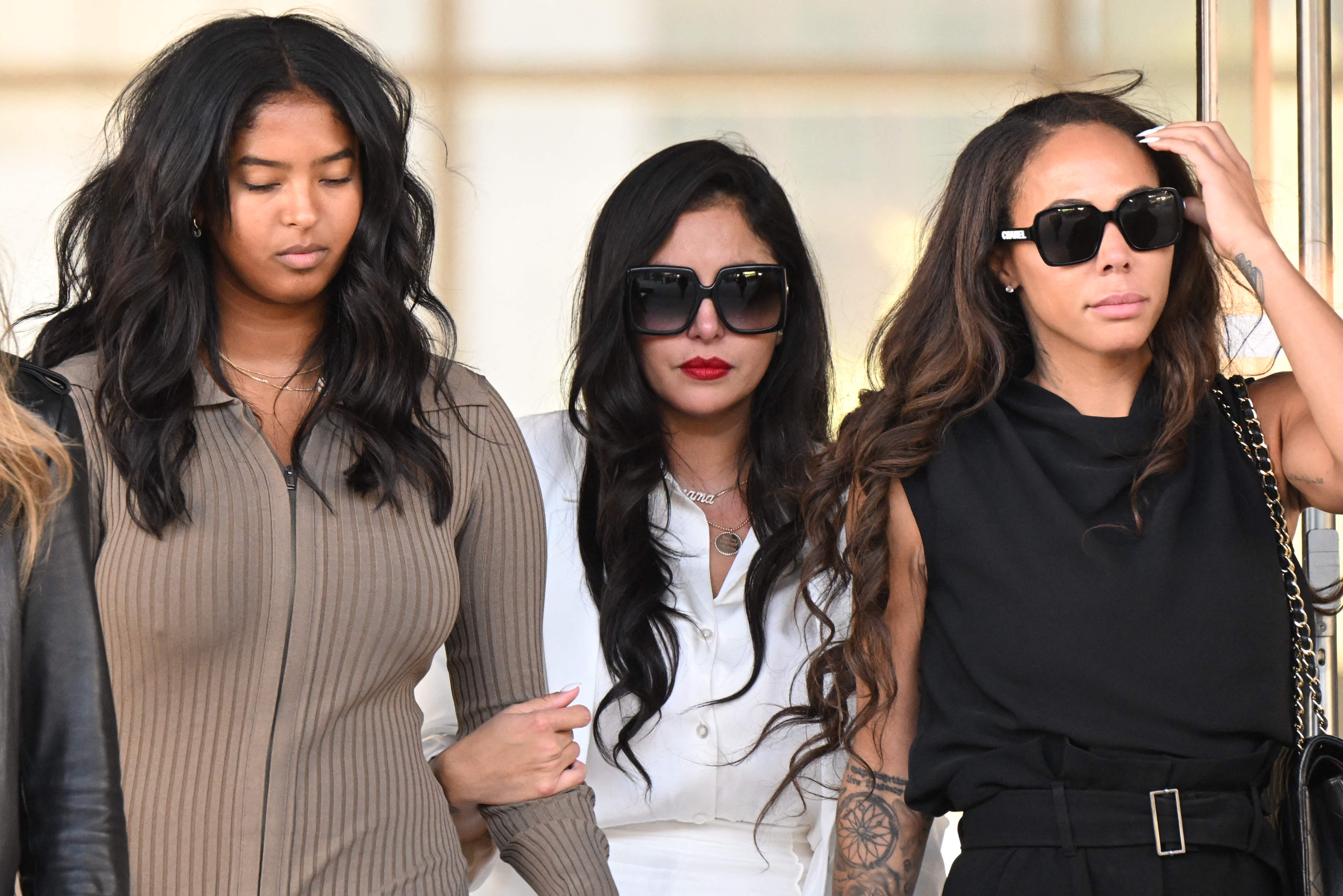 Vanessa Bryant, centre, her daughter Natalia Bryant, left, and close friend Sydney Leroux leave the court house in Los Angeles after the verdict was reached