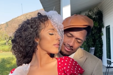 Nick Cannon appears to announce 10th child in photoshoot with model Brittany Bell