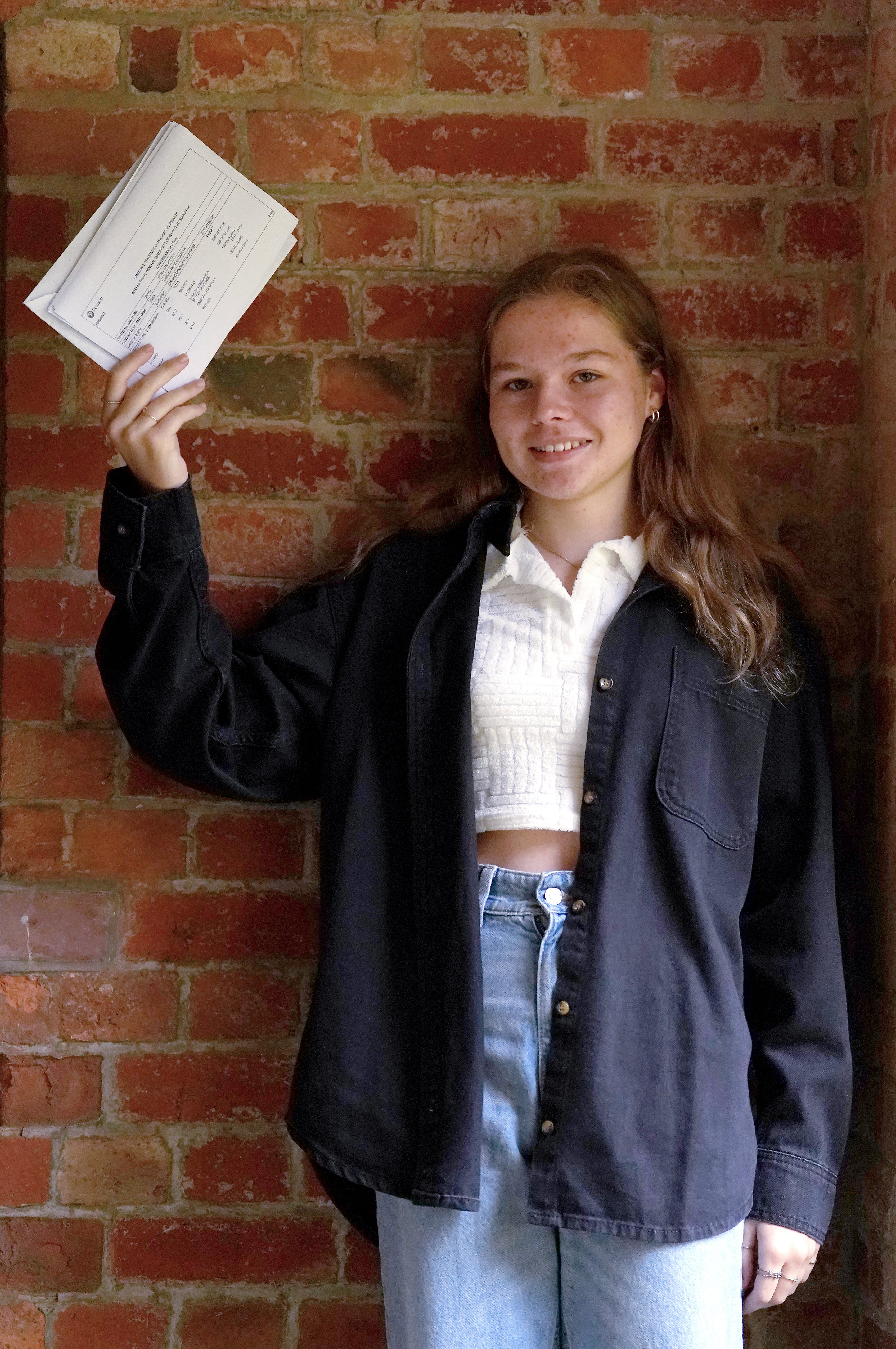 Rose Owens with her GCSE results at Roedean School in Brighton, East Sussex (Gareth Fuller/PA)