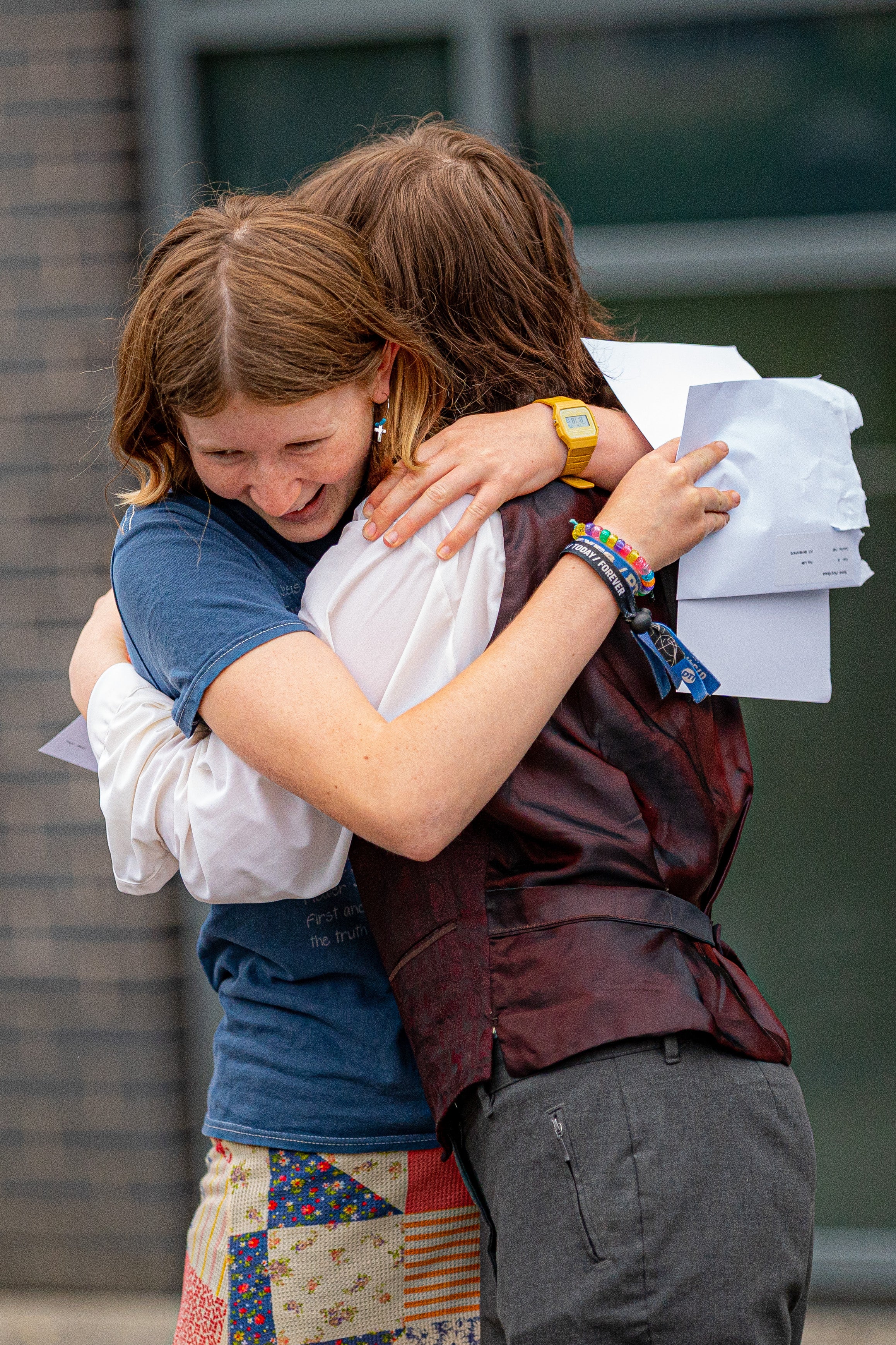 (from left) Grace Ford and Miriam McGrath hug as they open their GCSE results (Ben Birchall/PA)