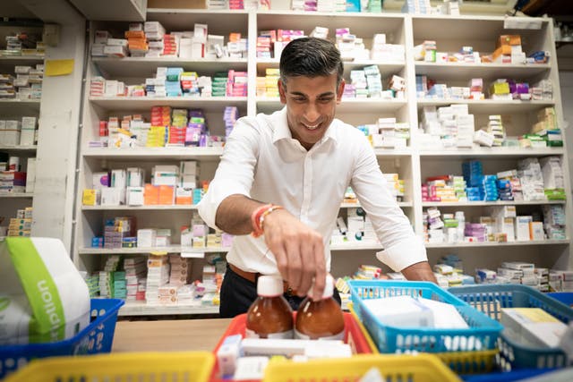 Rishi Sunak during a visit to his family’s old business, Bassett Pharmacy, in Southampton, Hampshire (Stefan Rousseau/PA)