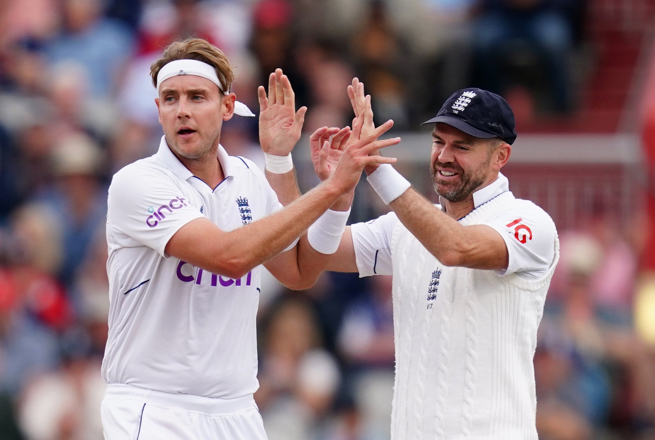 Stuart Broad and James Anderson celebrate after England’s successful morning session