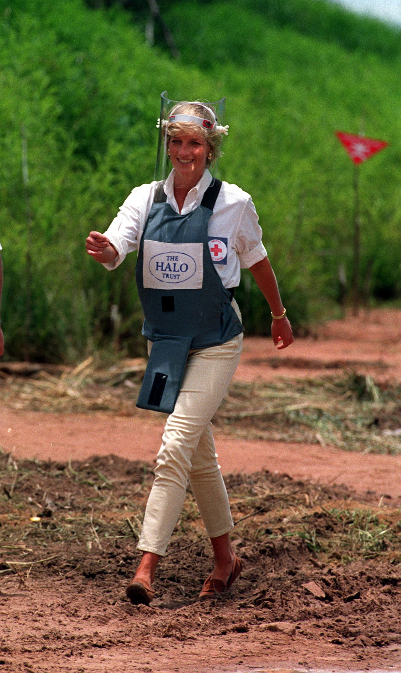 Diana walks through a minefield in Angola to see the work of the British Red Cross (John Stillwell/PA)