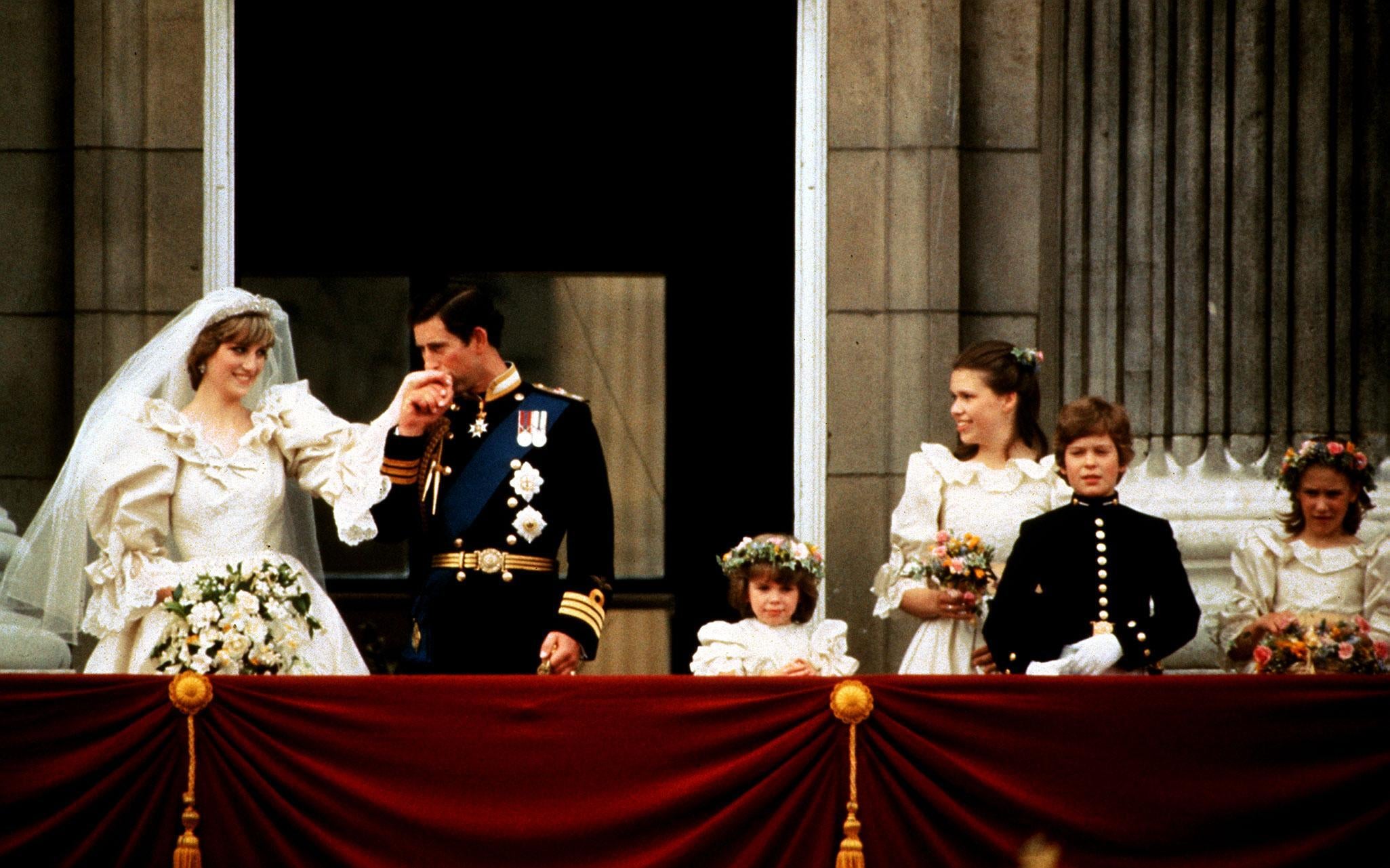 The Prince and Princess of Wales on the Palace balcony on their wedding day (PA)