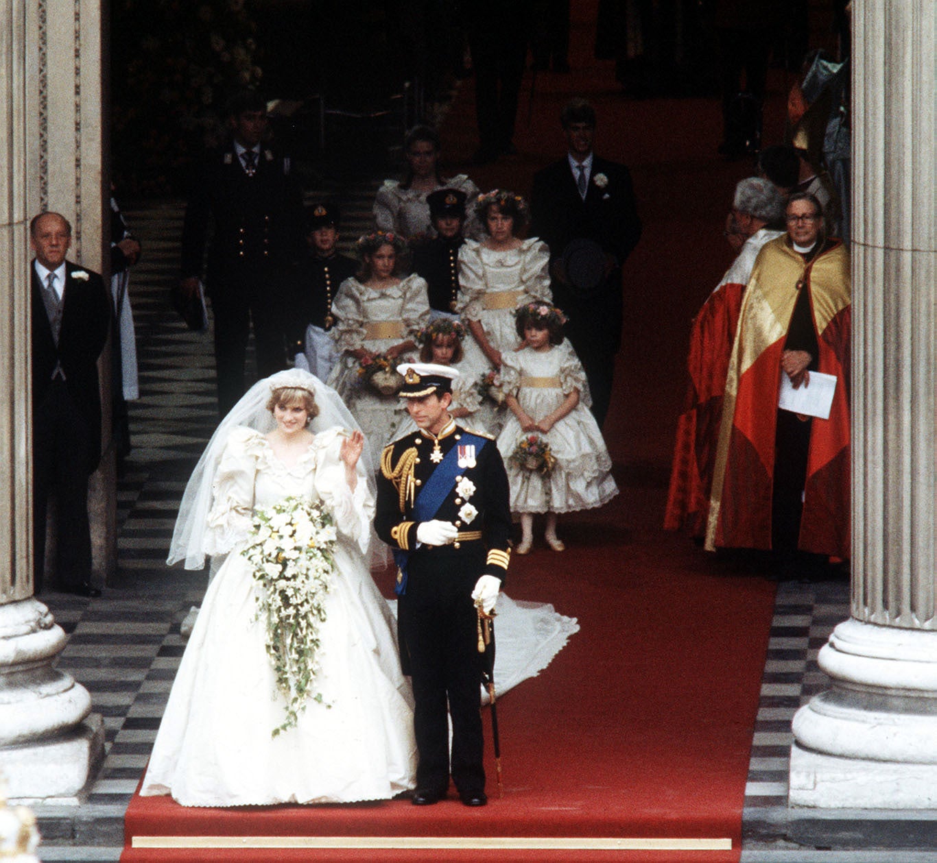 The Princess of Wales waves to the crowds as she leaves St Paul’s Cathedral with her husband, the Prince of Wales, after their wedding in 1981 (PA)