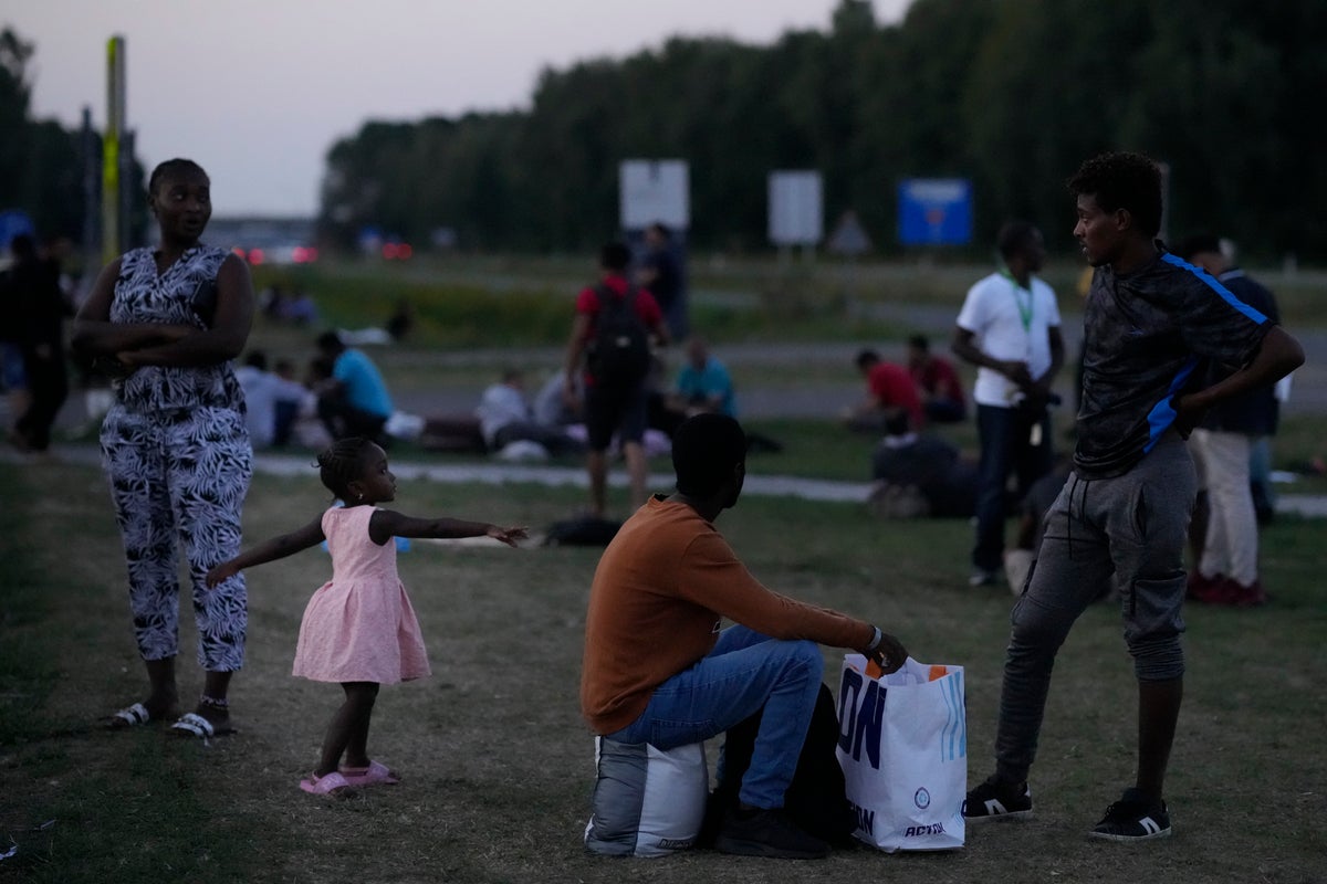 Buses move 400 asylum-seekers from squalid Dutch camp