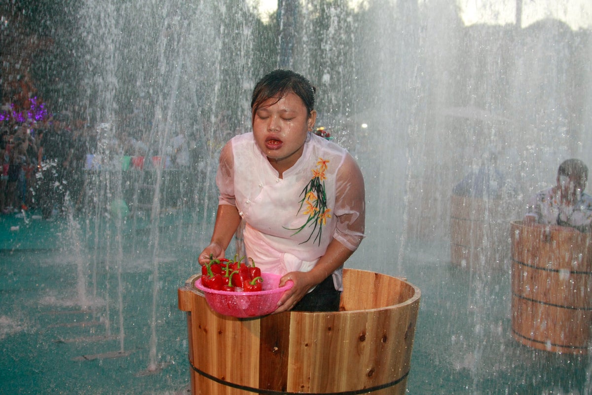 Cave restaurants and standing on ice buckets: How China’s citizens are tackling extreme heat