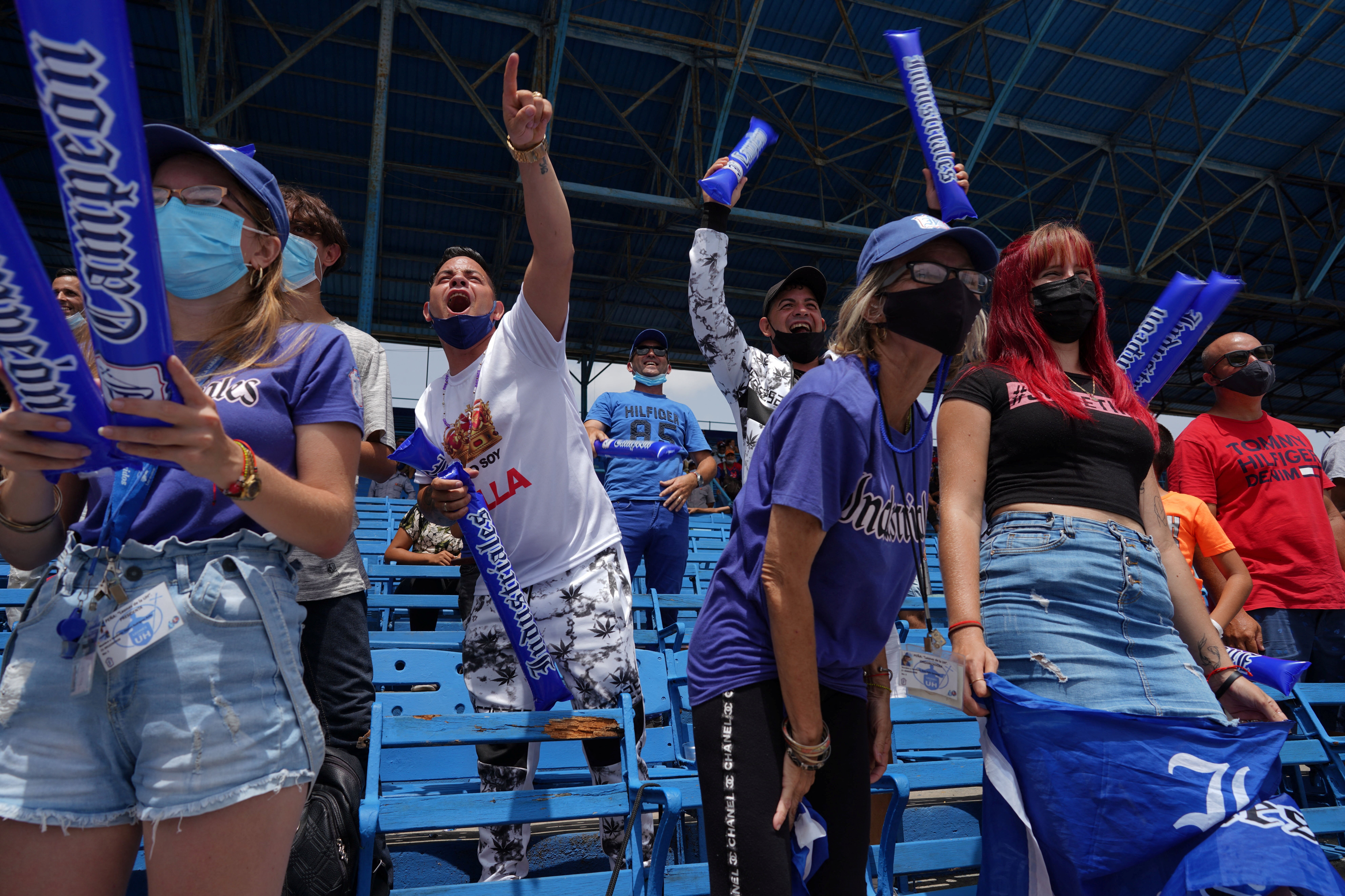 Supporters of Industriales baseball team react during a match against Artemisa