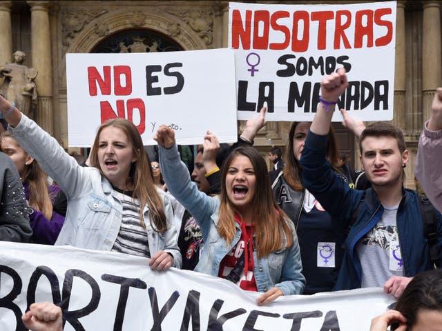 <p>Demonstrators shout slogans in Pamplona during a protest over the gang rape of an 18-year-old in 2016 </p>