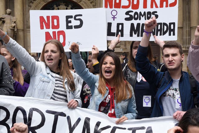 <p>Demonstrators shout slogans in Pamplona during a protest over the gang rape of an 18-year-old in 2016 </p>