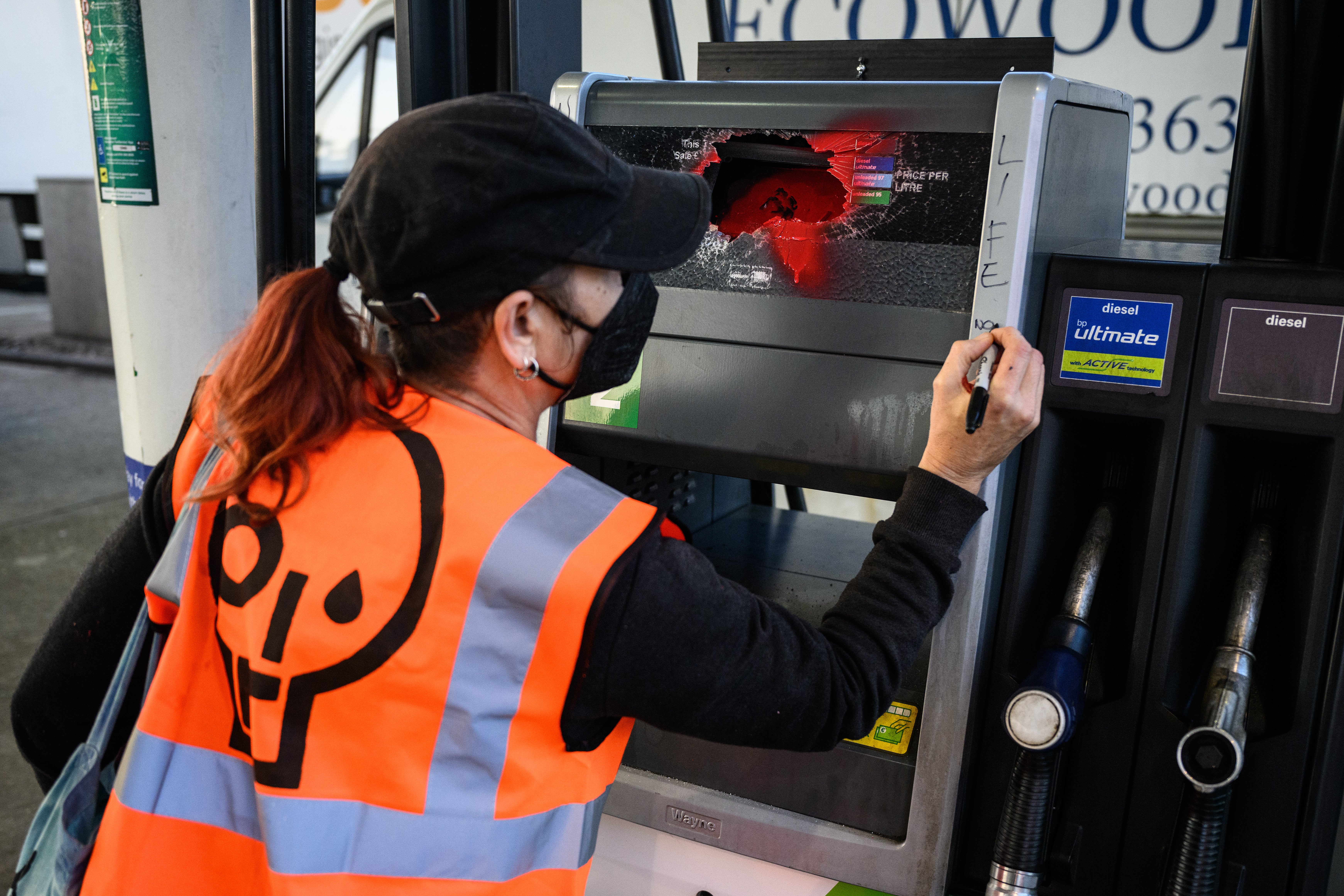 Activists smashed the glass in pumps and left messages on them