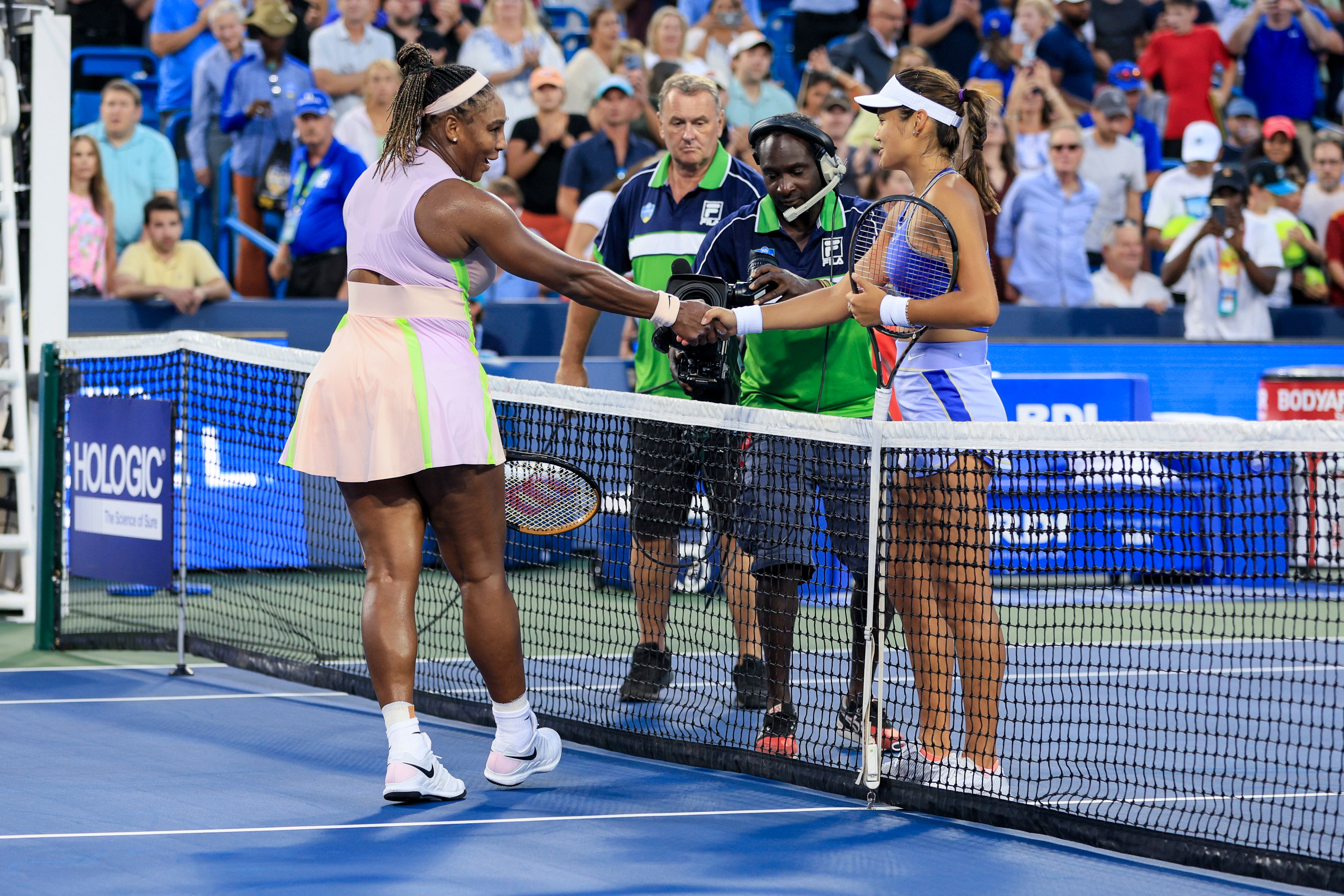 Emma Raducanu (right) defeated Serena Williams in Cincinnati (Aaron Doster/AP)