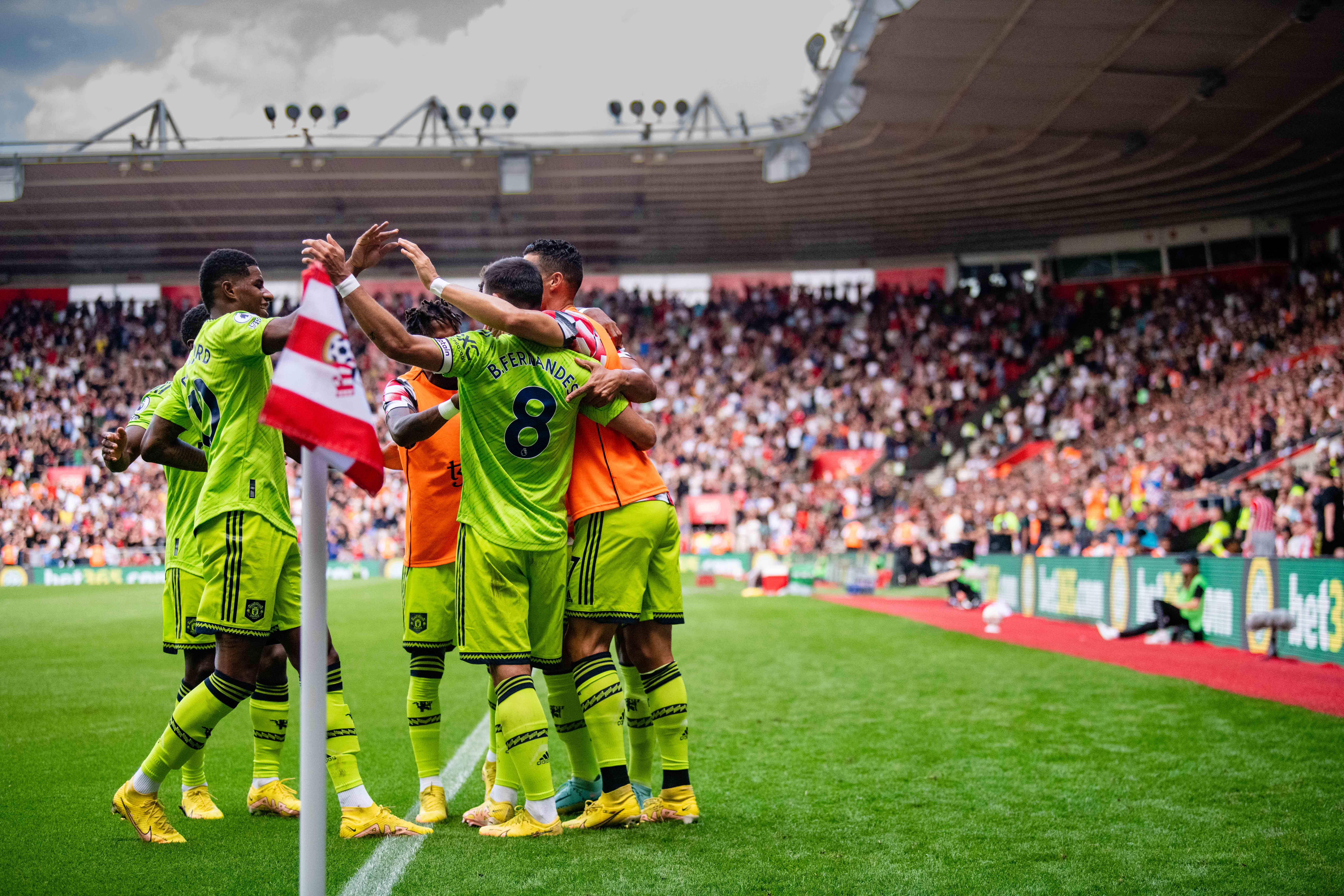 The visitors celebrate their goal at St Mary’s