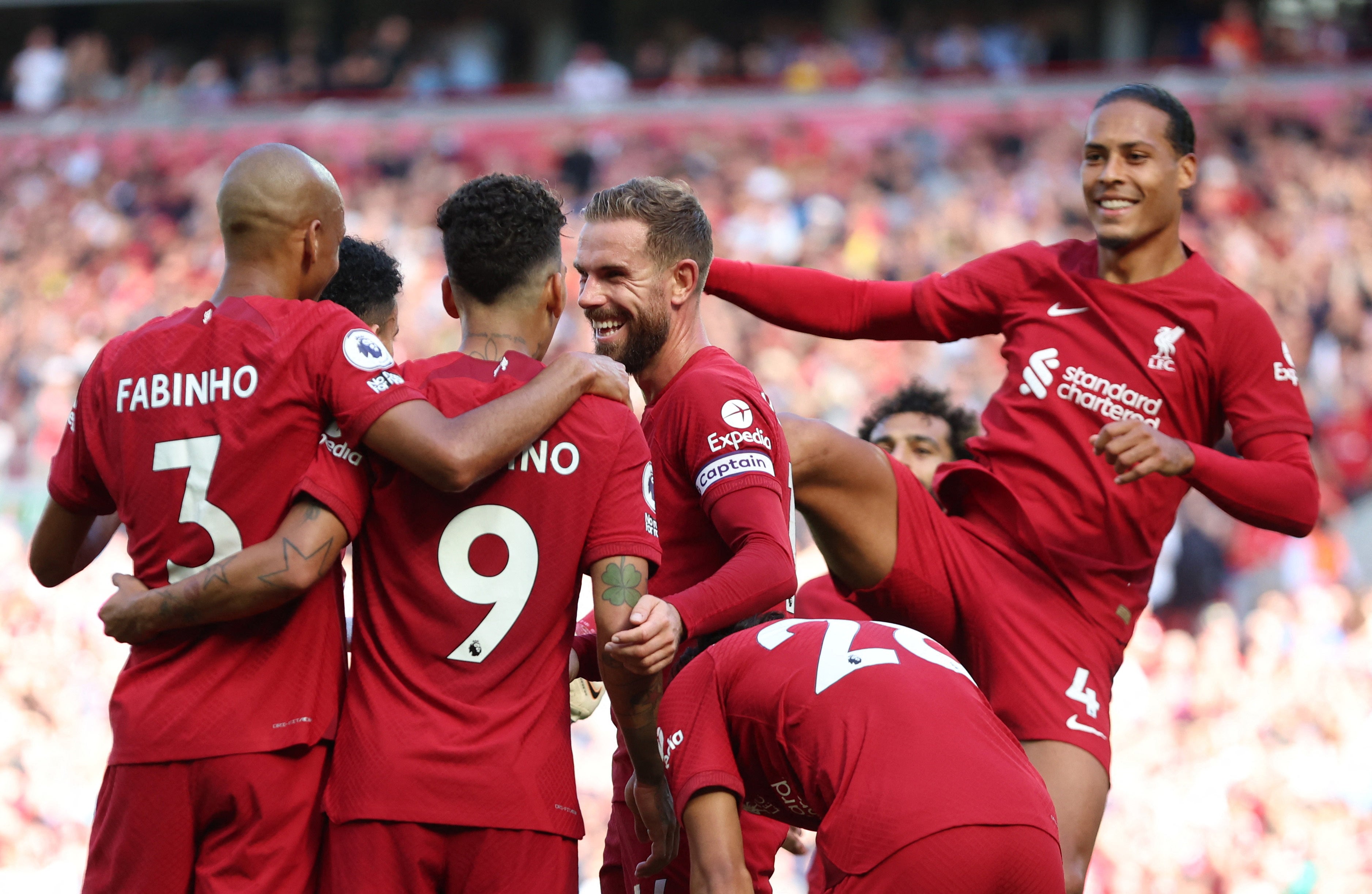 Roberto Firmino (9) is congratulated after scoring his side’s seventh, following on from his first-half goal and three assists