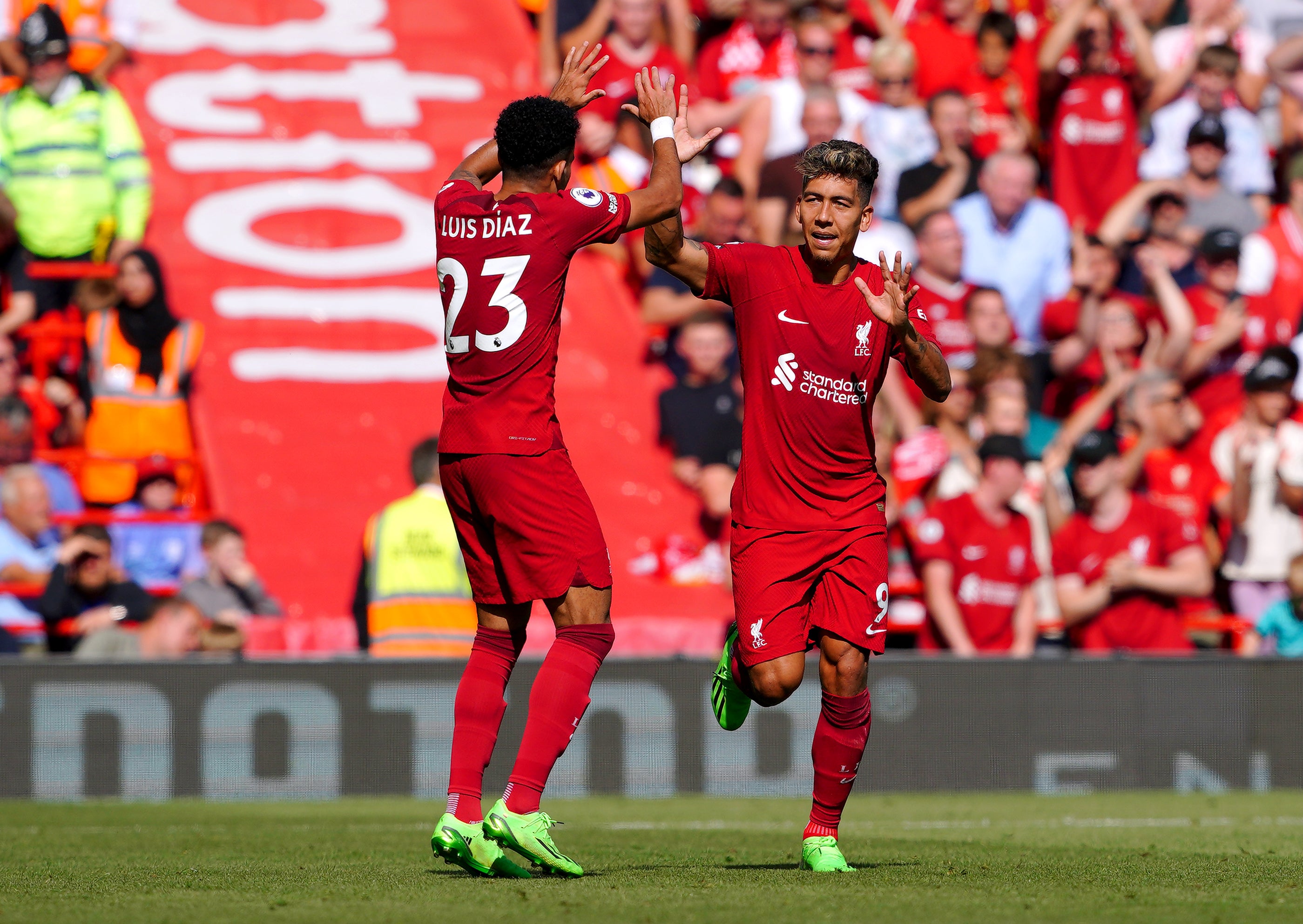 Roberto Firmino, right, inspired Liverpool’s rout as Luis Diaz also scored twice (Peter Byrne/PA)